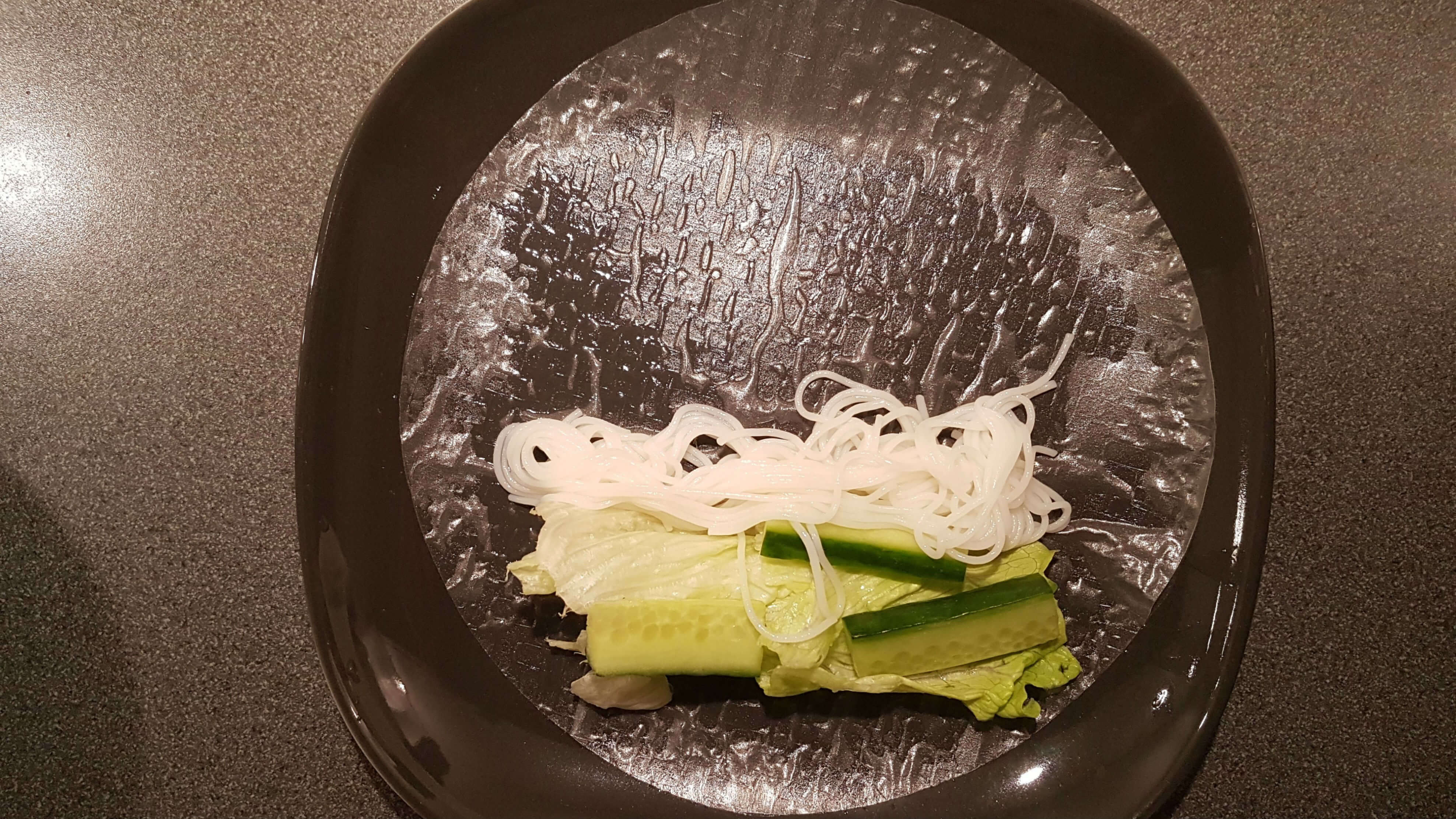 Add rice vermicelli, cucumber and salad